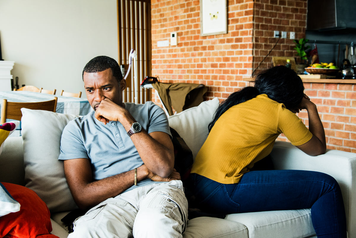 Couple on couch after an arguement. Breaking the Conflict Cycle: Why You Keep Fighting